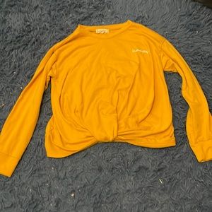 Yellow front tie long sleeve shirt.
